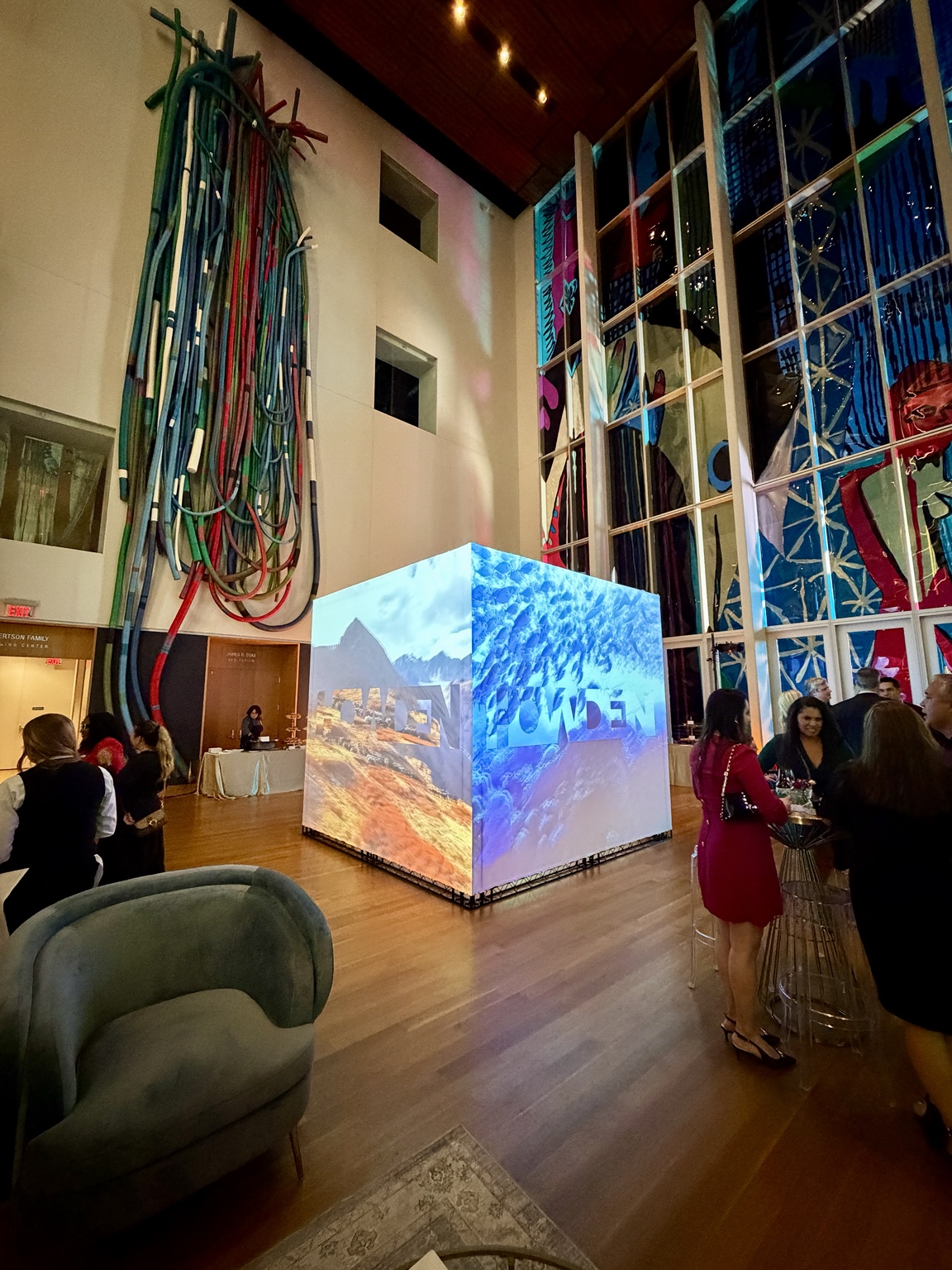 A projection Cube with mountain and underwater visuals at an indoor event