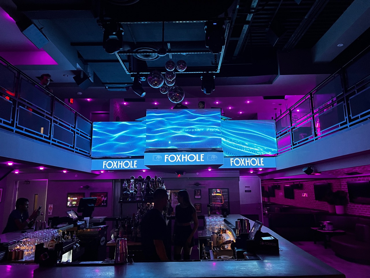 Blue wave visuals across the Foxhole bar installation